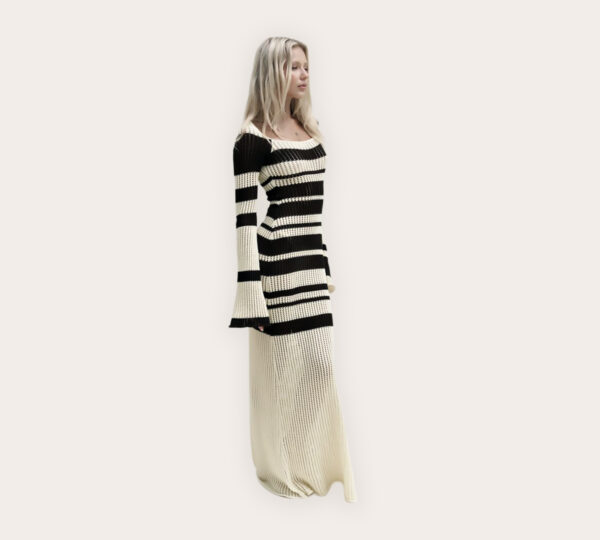 a woman in a black and white striped dress
